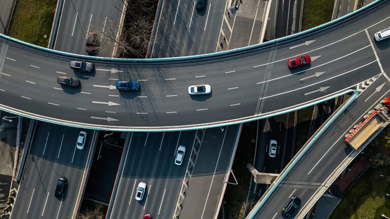 Top,Up,Aerial,Drone,View,Of,Elevated,Road,And,Traffic