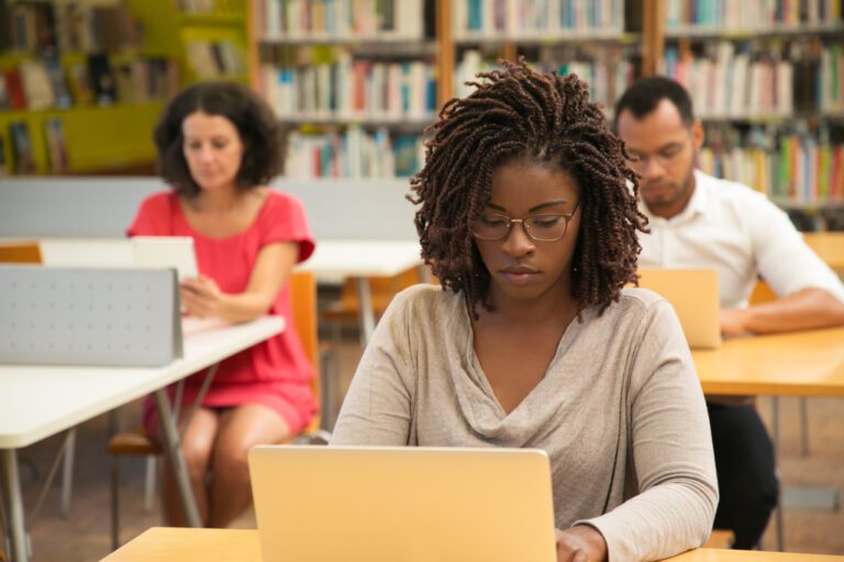 Serious,African,American,Student,Studying,In,Library,Computer,Class.,People