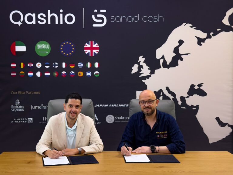 Armin Moradi, Founder & CEO of Qashio, signing the agreement with Mahmoud Iswaid, Co-Founder & CEO of Sanad Cash