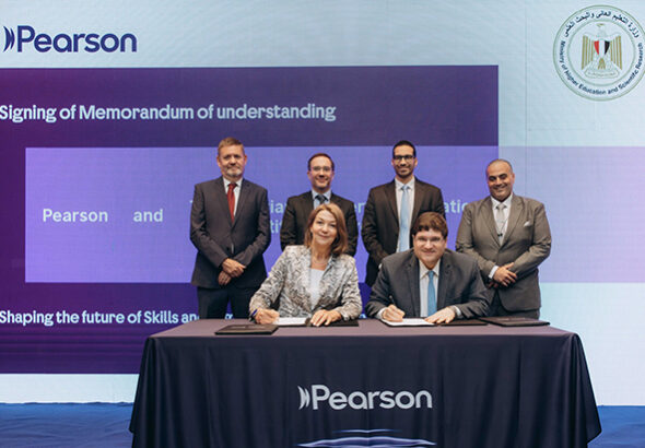 WeTell x British Council - MOHE Signing - Jane Baker from Pearson signs the MoU alongside Dr Ayman Farid